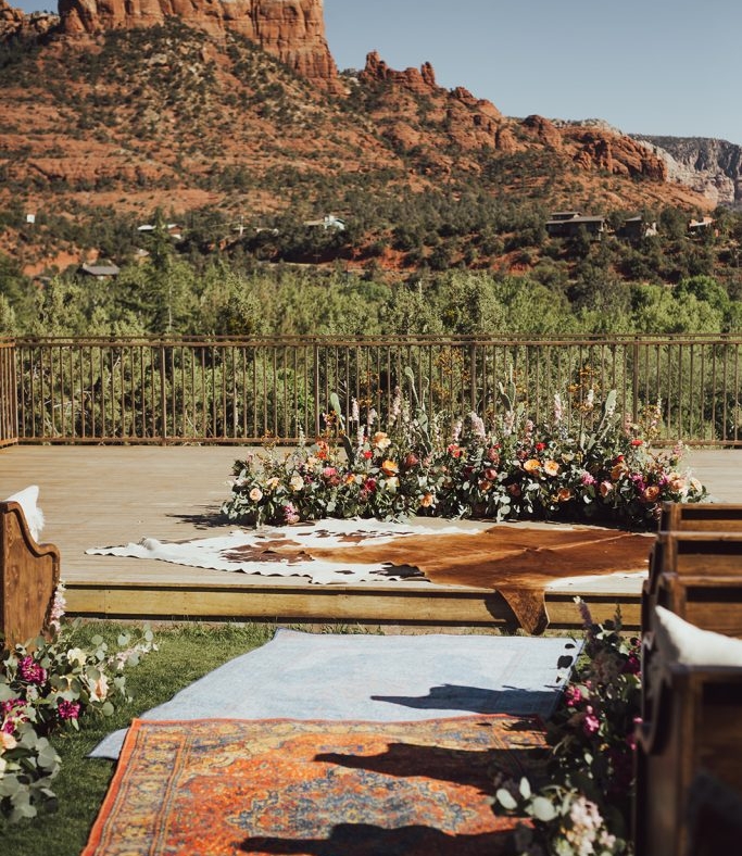 Empty wedding ceremony set up overlooking a red mesa