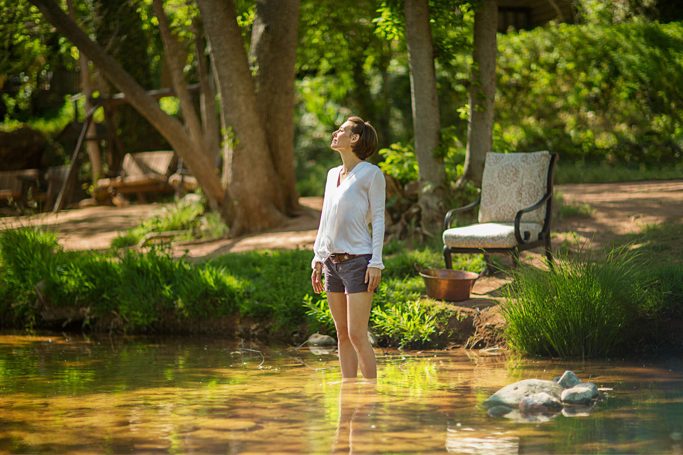 Forest Bathing - Woman standing in creek