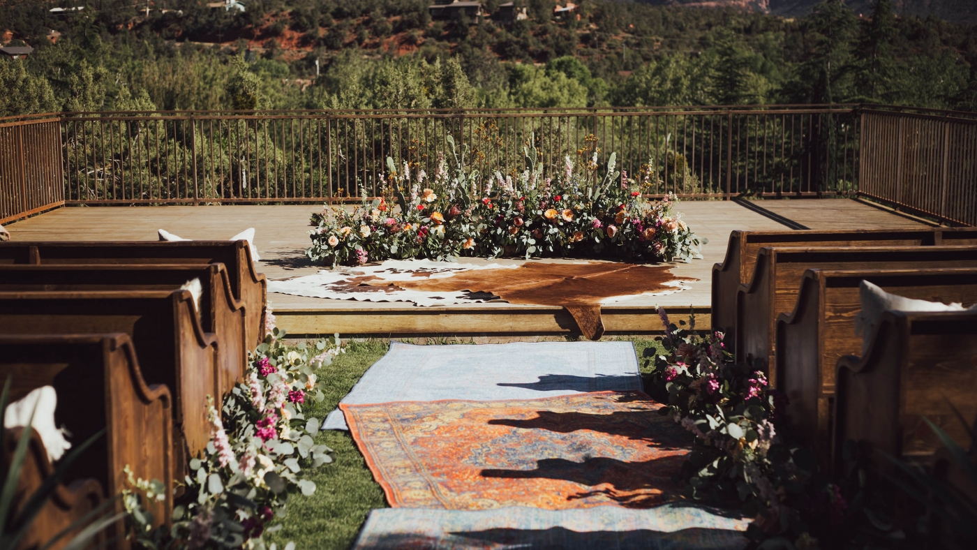 Outdoor terrace set for a wedding with flowers in the sunshine