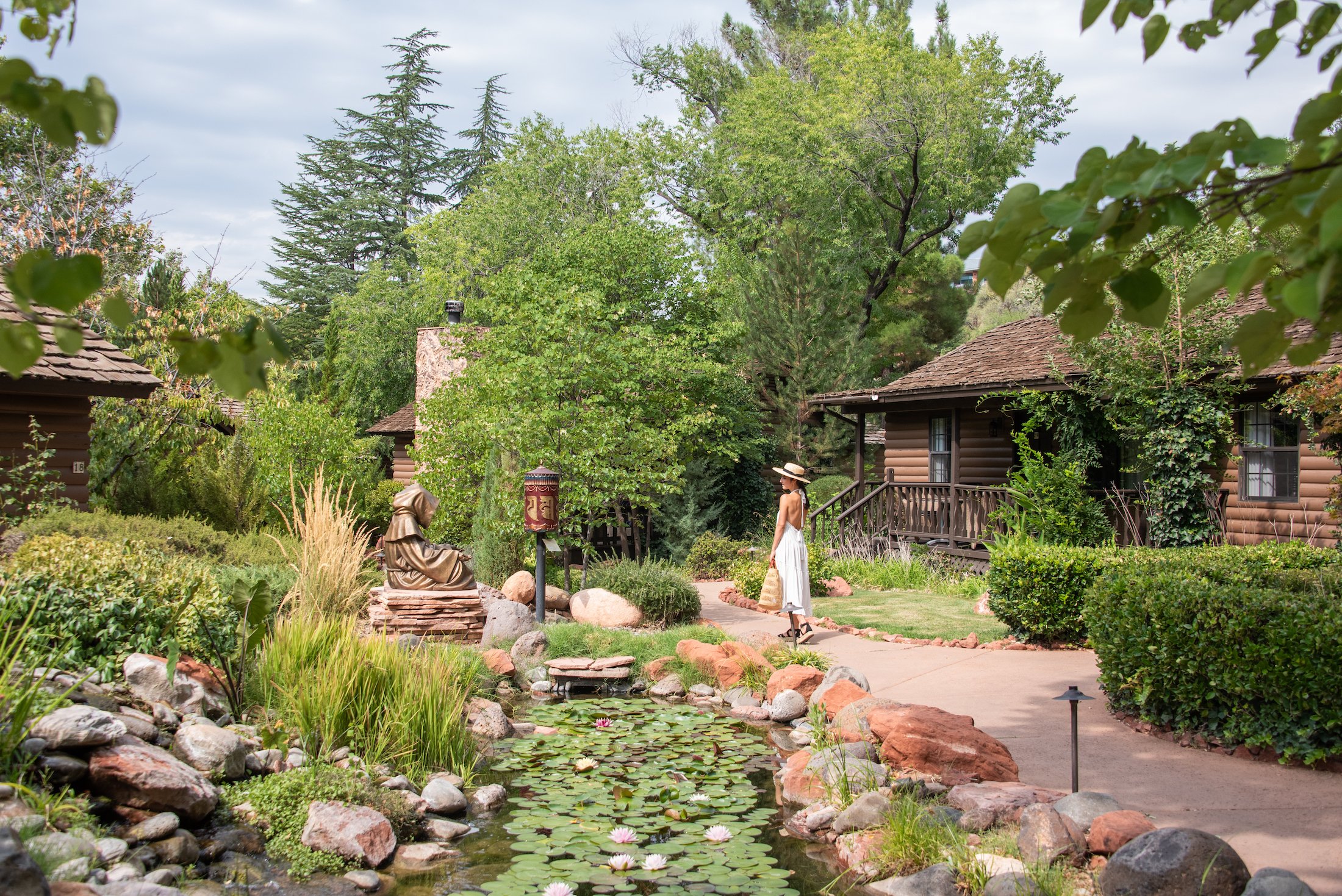 Guest Strolling through L'Auberge Gardens