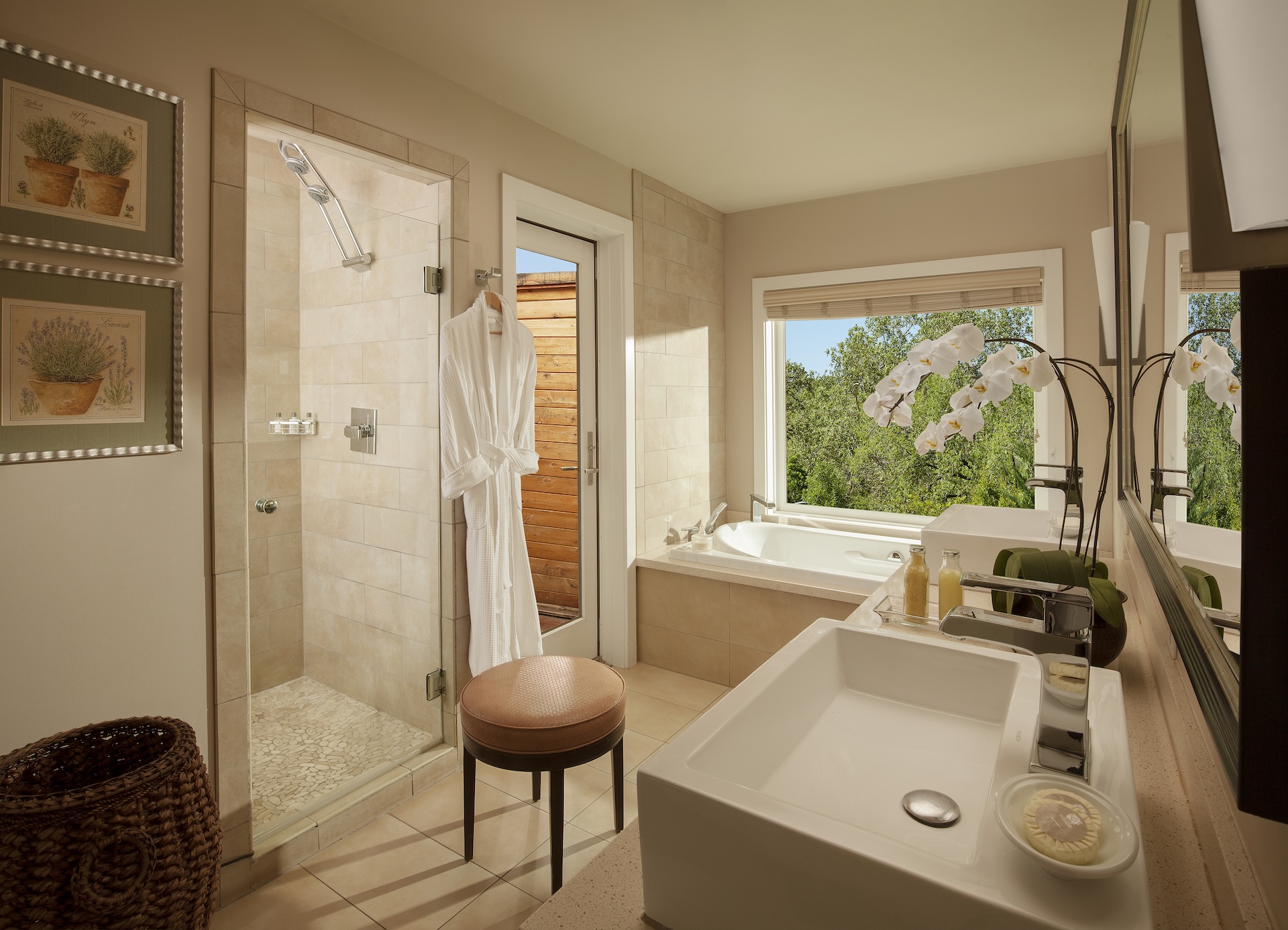 A bathroom with a shower, bathtub, and sink