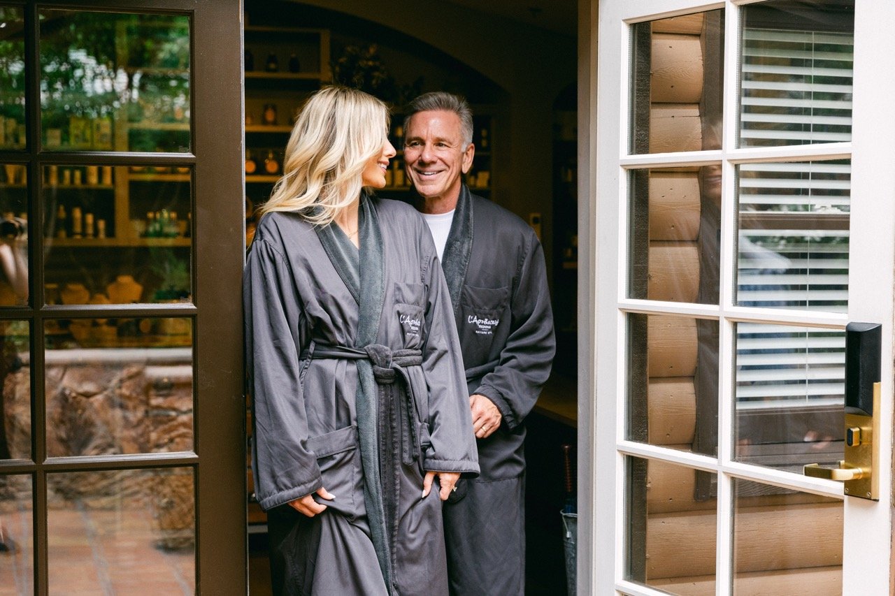 Two people in robes at L'Apothecary spa