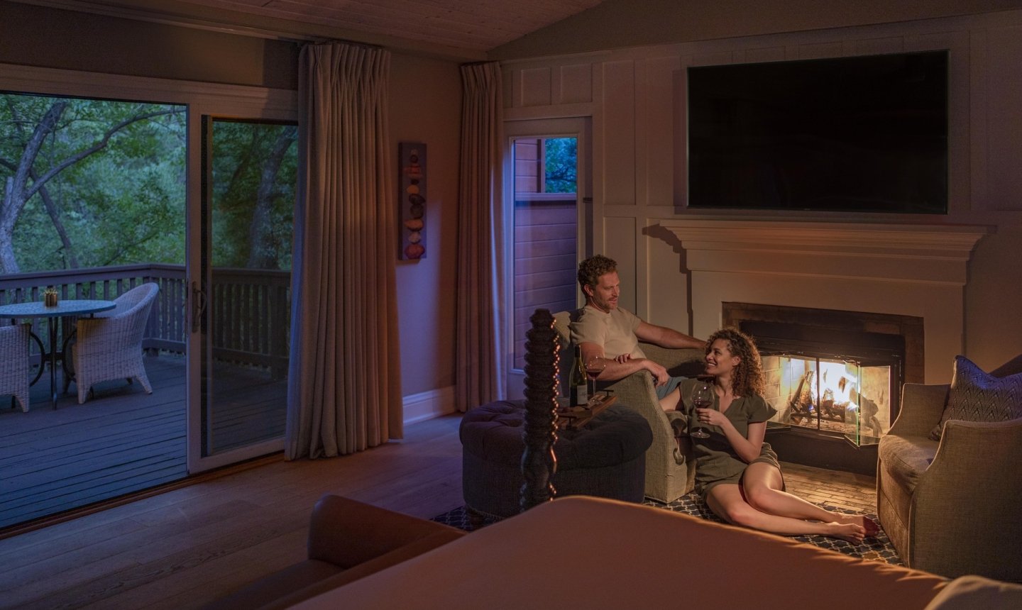 Couple sitting by the fireplace