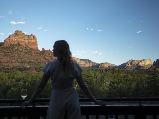 Woman looking at the view on the balcony