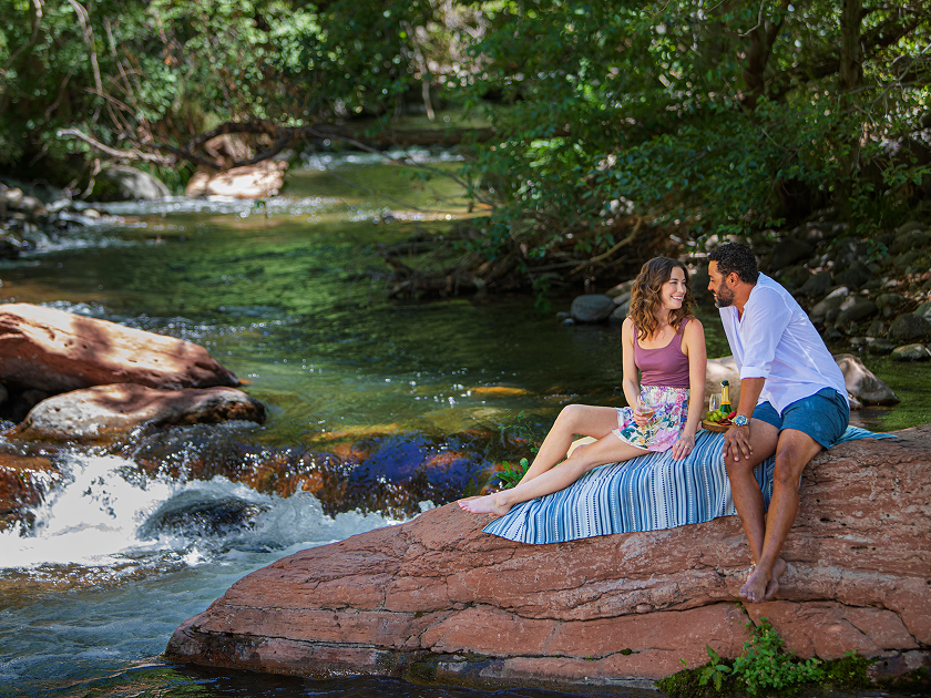 Couple picnicking on a rock in Oak Creek