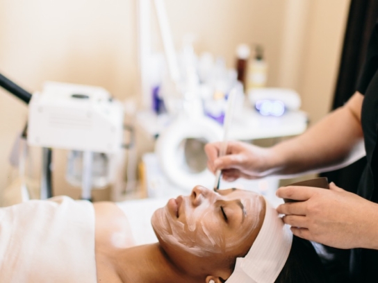 Person receiving facial treatment at L'Apothecary spa