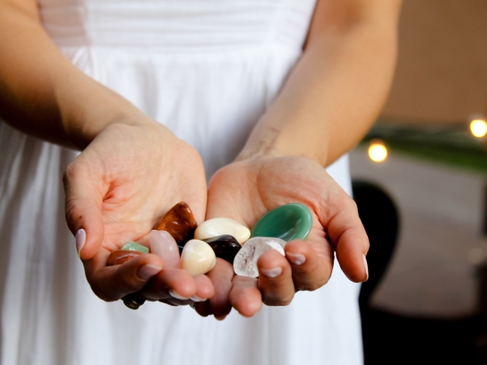 Woman holding colorful stones