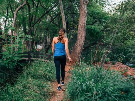 Woman Walking Alone Creekside