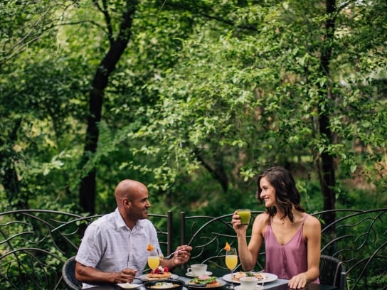 Sunday Brunch Creekside with a couple and full table